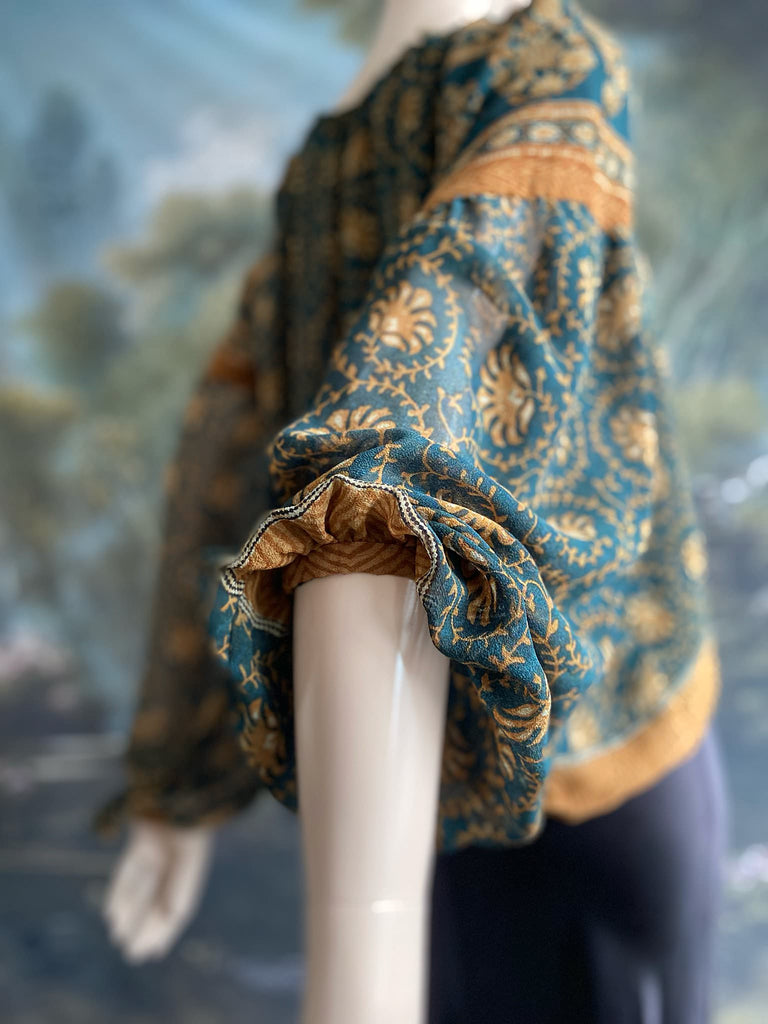Dark teal green and ochre silk georgette blouse with long full sleeves and adjustable drawstring neckline. Bohemian styles sustainably created from antique and vintage textiles by the Pavilion Parade studio. 