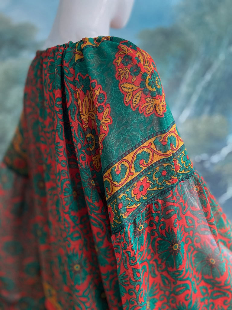 Emerald, paprika and sunflower yellow silk georgette blouse with long full sleeves and adjustable drawstring neckline. Bohemian styles sustainably created from antique and vintage textiles by the Pavilion Parade studio. 