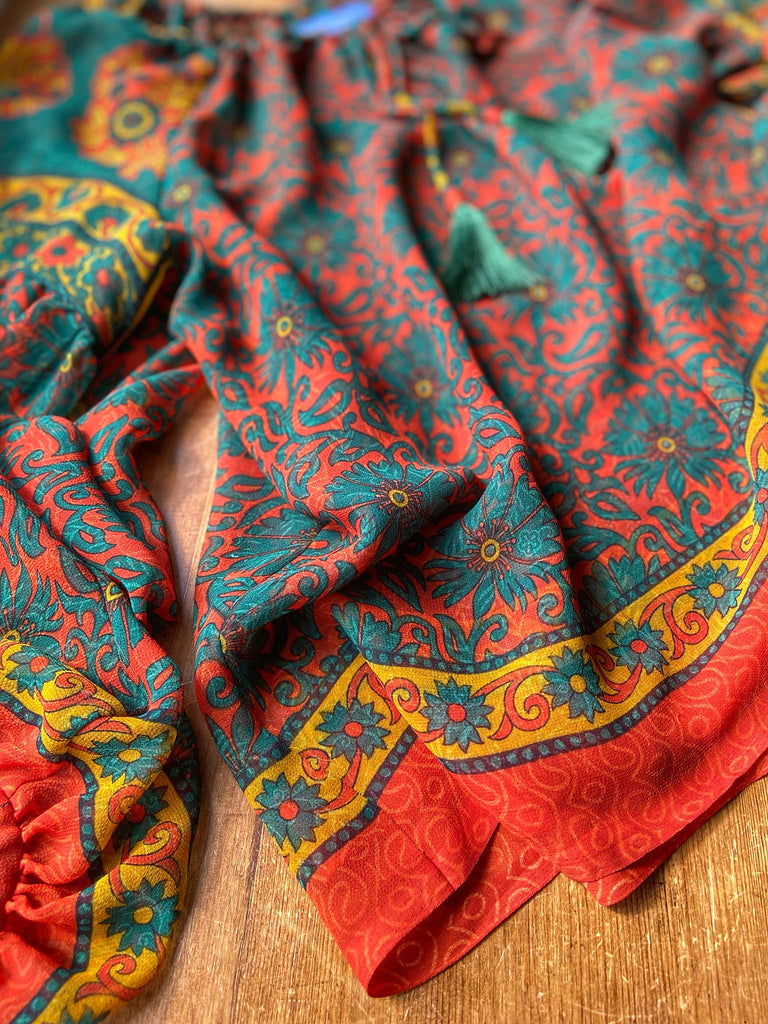 Emerald, paprika and sunflower yellow silk georgette blouse with long full sleeves and adjustable drawstring neckline. Bohemian styles sustainably created from antique and vintage textiles by the Pavilion Parade studio. 