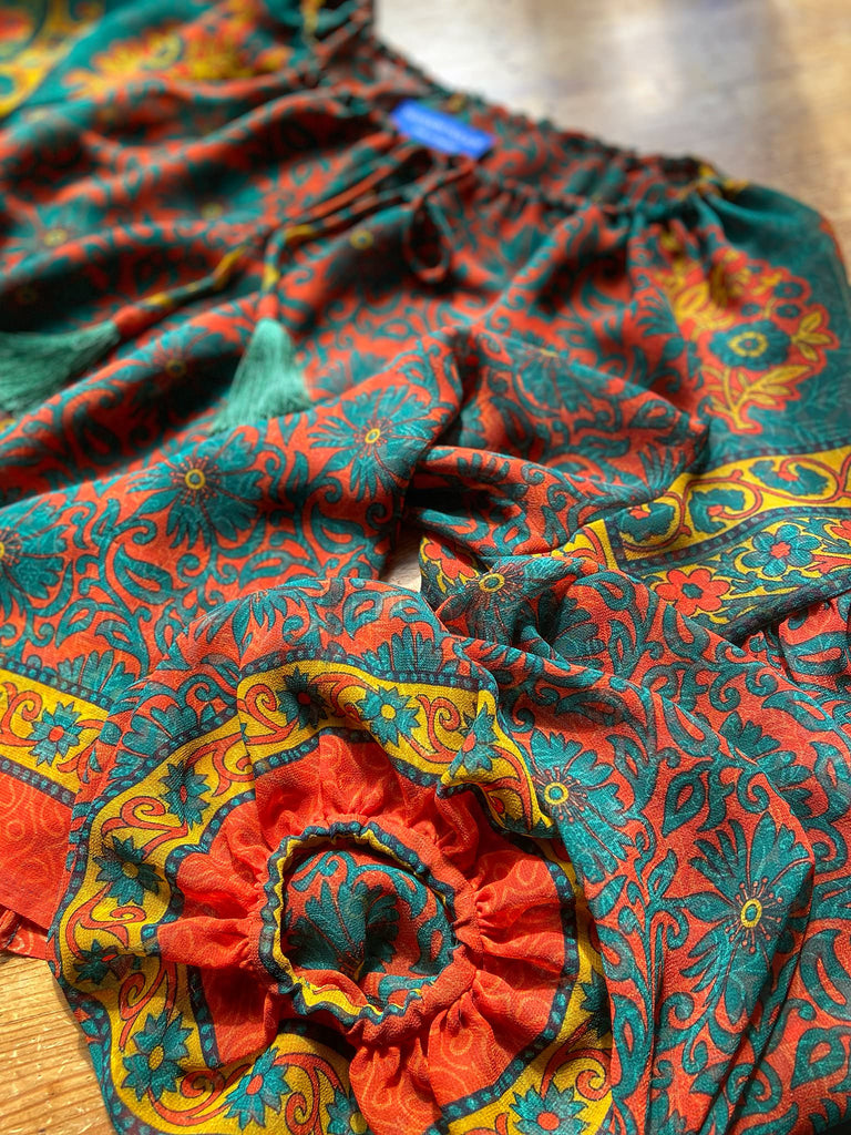 Emerald, paprika and sunflower yellow silk georgette blouse with long full sleeves and adjustable drawstring neckline. Bohemian styles sustainably created from antique and vintage textiles by the Pavilion Parade studio. 