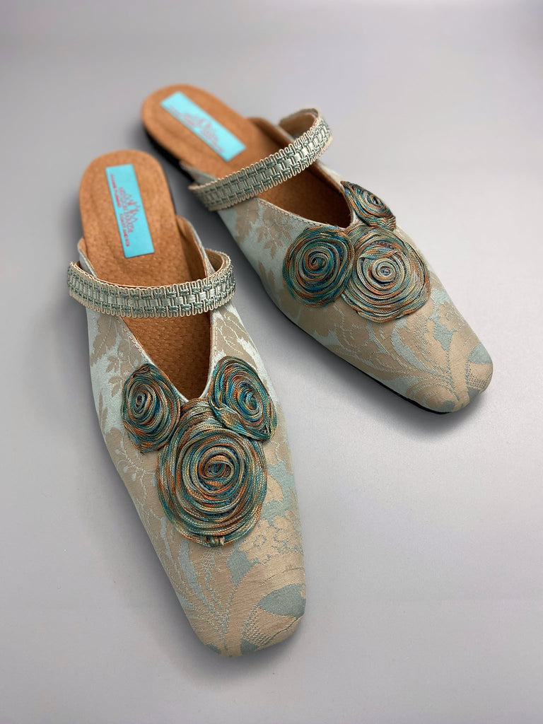 Duck egg blue and bronze square toed silk damask shoes with silk ribbon roundels and graid straps. Bohemian styles sustainably created from antique textiles by the Pavilion Parade studio.