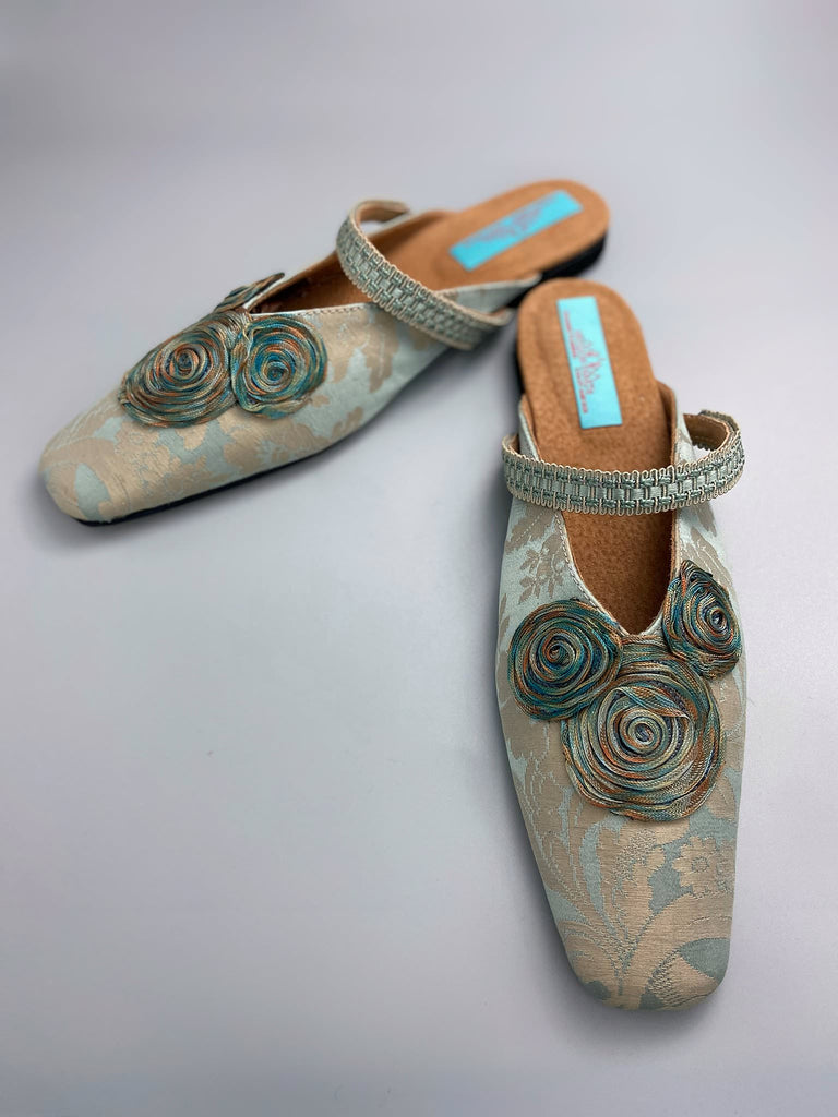 Duck egg blue and bronze square toed silk damask shoes with silk ribbon roundels and graid straps. Bohemian styles sustainably created from antique textiles by the Pavilion Parade studio.