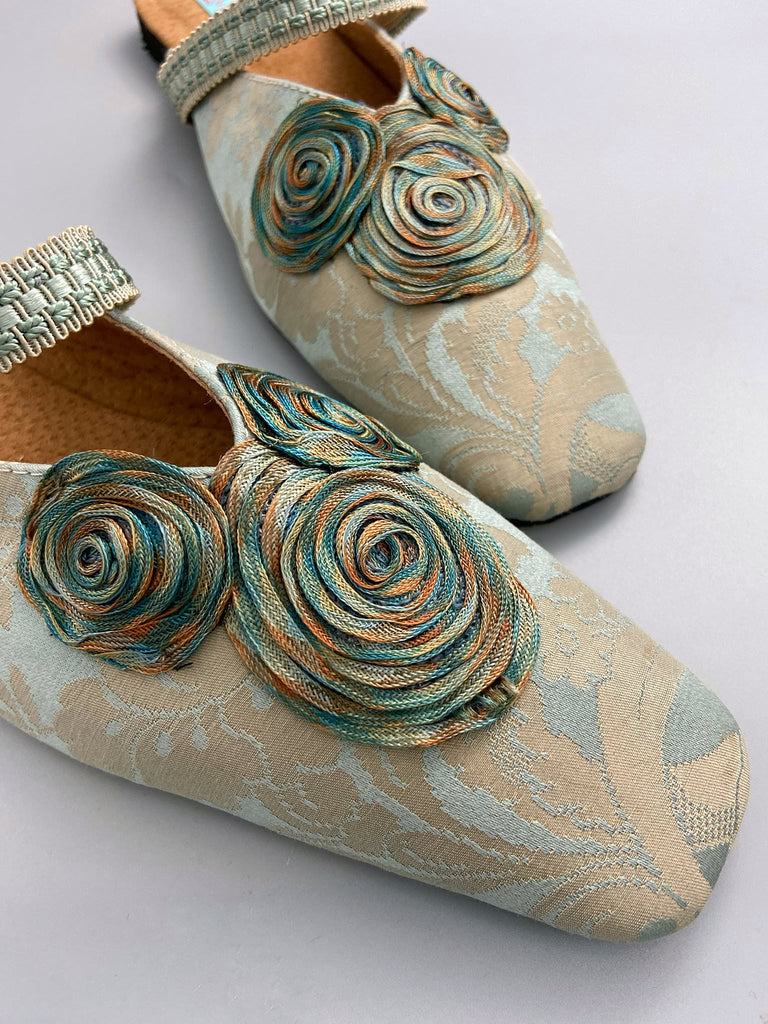 Duck egg blue and bronze square toed silk damask shoes with silk ribbon roundels and graid straps. Bohemian styles sustainably created from antique textiles by the Pavilion Parade studio.