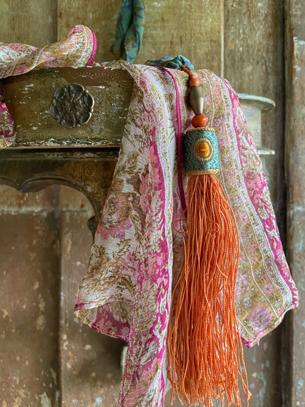 1920s style long silk sautoir necklace with antique tassel embellishment. Bohemian style from vintage textiles by Pavilion Parade. 