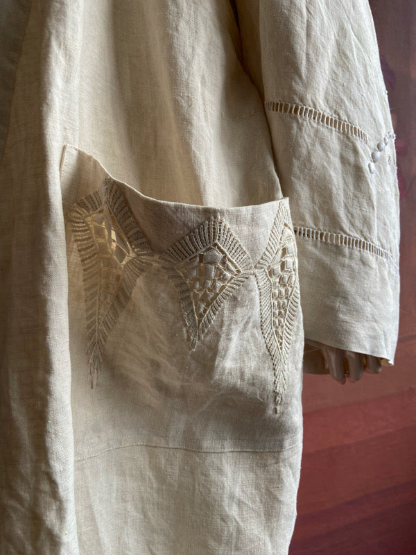Full length kimono inspired robe with large patch pockets and wide sleeves. Created from an antique heavy French linen trousseau sheet with heirloom embroidery and drawn thread work. All French seamed with hand finished hems and collar. Bohemian styles sustainably created from antique and vintage textiles by the Pavilion Parade studio.