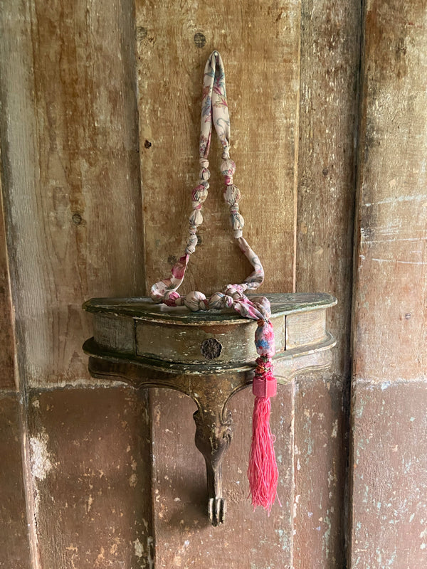 1920s style long silk sautoir necklace with antique tassel embellishment. Bohemian style from vintage textiles by Pavilion Parade. 