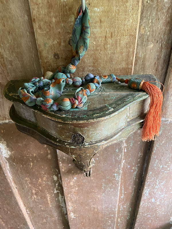 1920s style long silk sautoir necklace with antique tassel embellishment. Bohemian style from vintage textiles by Pavilion Parade. 