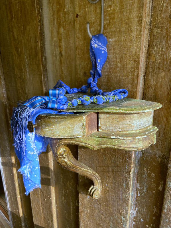 1920s style long silk sautoir necklace with antique tassel embellishment. Bohemian style from vintage textiles by Pavilion Parade. 