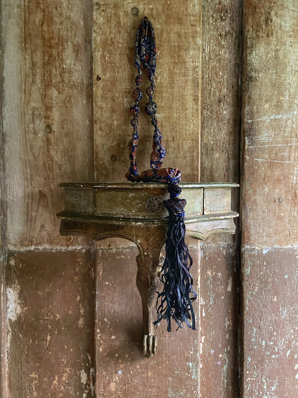 1920s style long silk sautoir necklace with antique tassel embellishment. Bohemian style from vintage textiles by Pavilion Parade. 