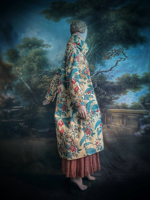 Funnel neck opera coat created from a vintage cotton Indienne featuring exotic birds and florals. Bohemian style created from vintage and antique textiles by Pavilion Parade