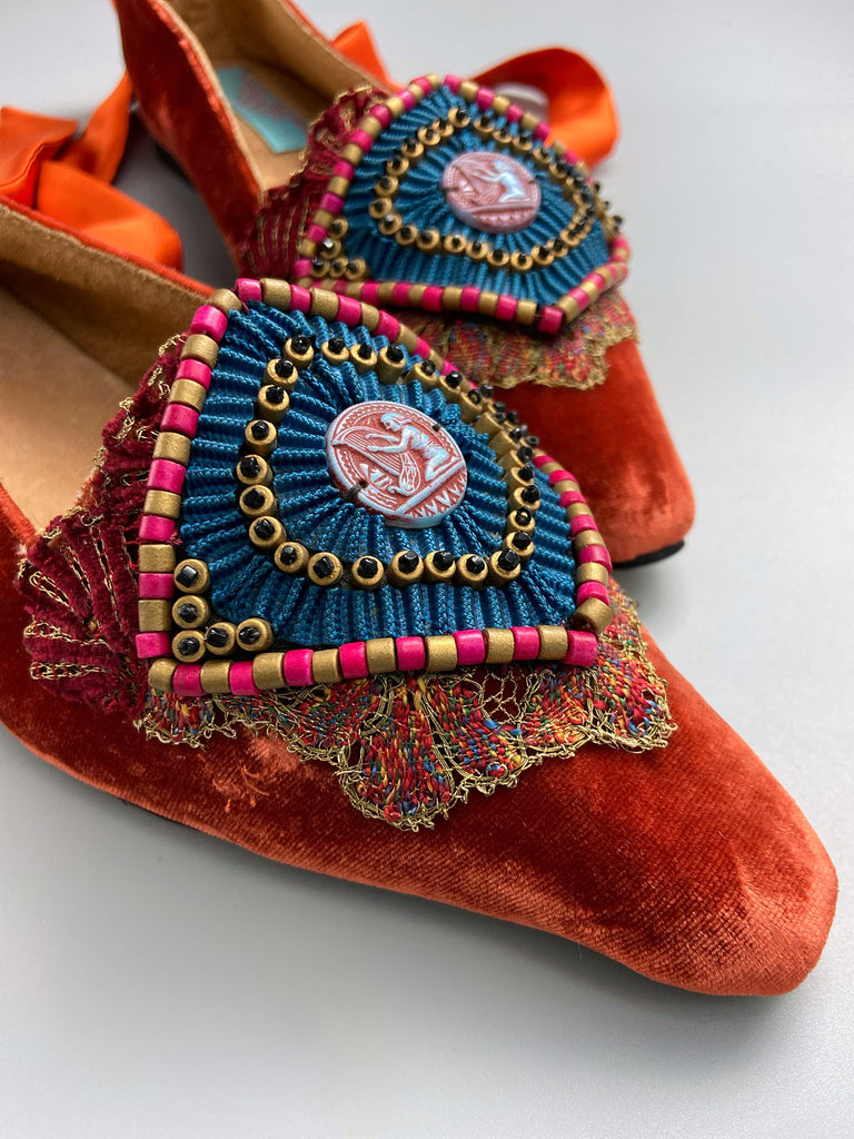 Silk velvet pointed toe slipper shoes with original 1920s Egyptian Revival embellishment and silk satin ankle ribbons. Bohemian styles created from antique textiles by the Pavilion Parade studio.