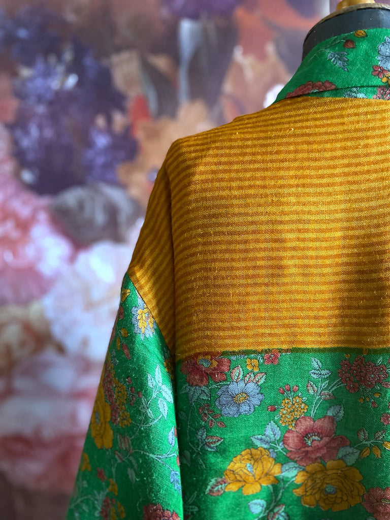Emerald green and saffron yellow floral fine wool robe with silk lining. Wide sleeves, deep pockets and tassel sash. Unique bohemian style created from vintage and antique textiles by the Pavilion Parade studio.