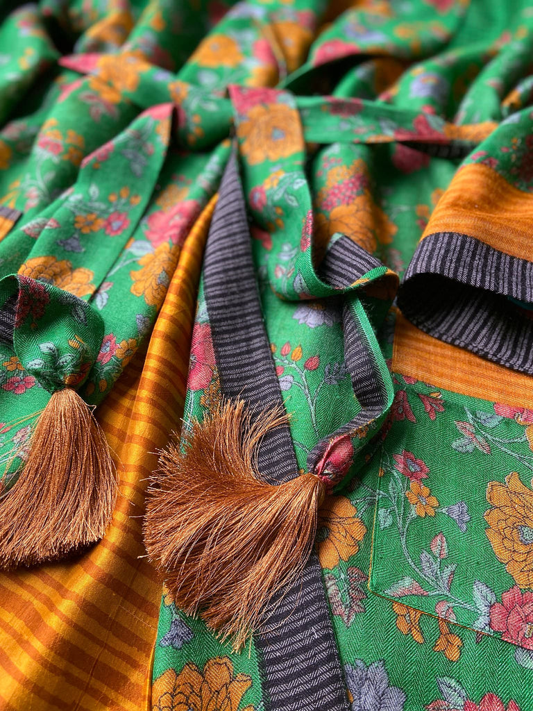 Emerald green and saffron yellow floral fine wool robe with silk lining. Wide sleeves, deep pockets and tassel sash. Unique bohemian style created from vintage and antique textiles by the Pavilion Parade studio.