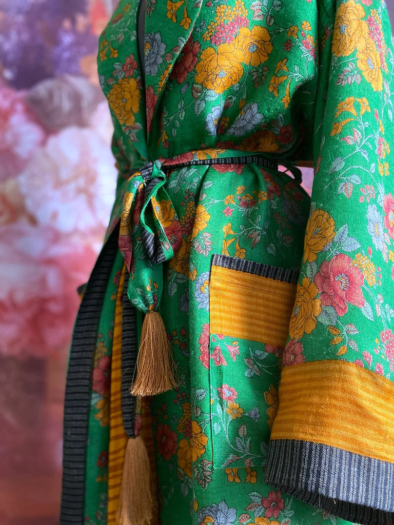 Emerald green and saffron yellow floral fine wool robe with silk lining. Wide sleeves, deep pockets and tassel sash. Unique bohemian style created from vintage and antique textiles by the Pavilion Parade studio.