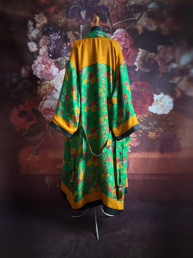 Emerald green and saffron yellow floral fine wool robe with silk lining. Wide sleeves, deep pockets and tassel sash. Unique bohemian style created from vintage and antique textiles by the Pavilion Parade studio.