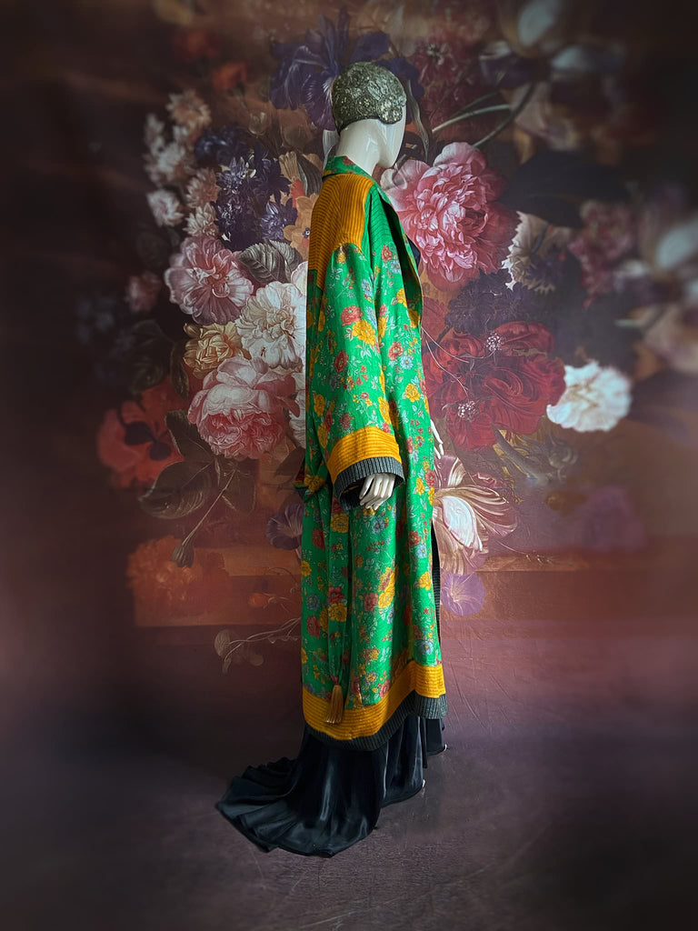 Emerald green and saffron yellow floral fine wool robe with silk lining. Wide sleeves, deep pockets and tassel sash. Unique bohemian style created from vintage and antique textiles by the Pavilion Parade studio.