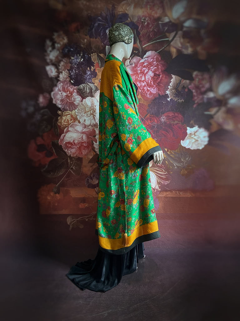 Emerald green and saffron yellow floral fine wool robe with silk lining. Wide sleeves, deep pockets and tassel sash. Unique bohemian style created from vintage and antique textiles by the Pavilion Parade studio.