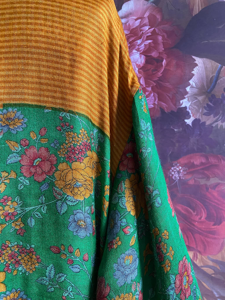 Emerald green and saffron yellow floral fine wool robe with silk lining. Wide sleeves, deep pockets and tassel sash. Unique bohemian style created from vintage and antique textiles by the Pavilion Parade studio.