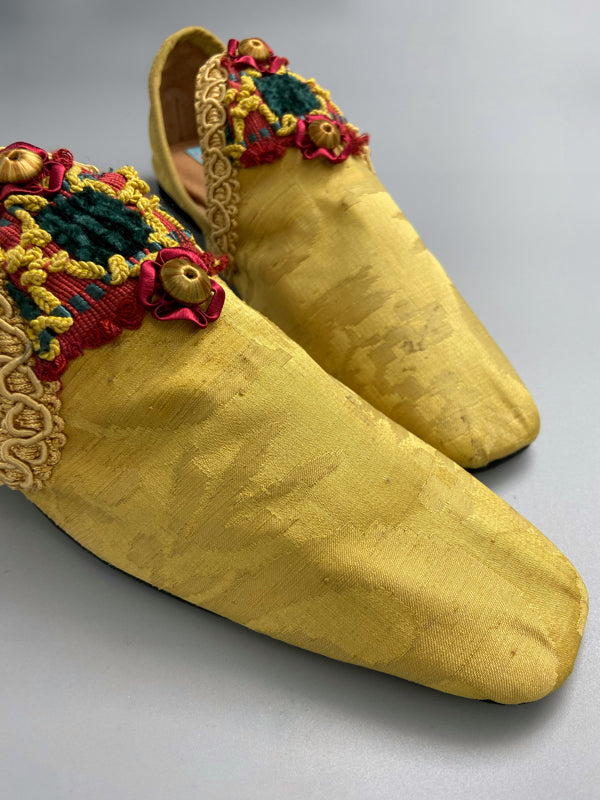 Golden yellow antique silk shoes with red and green silk chenille passementerie braid embellishment. Bohemian styles by Pavilion Parade
