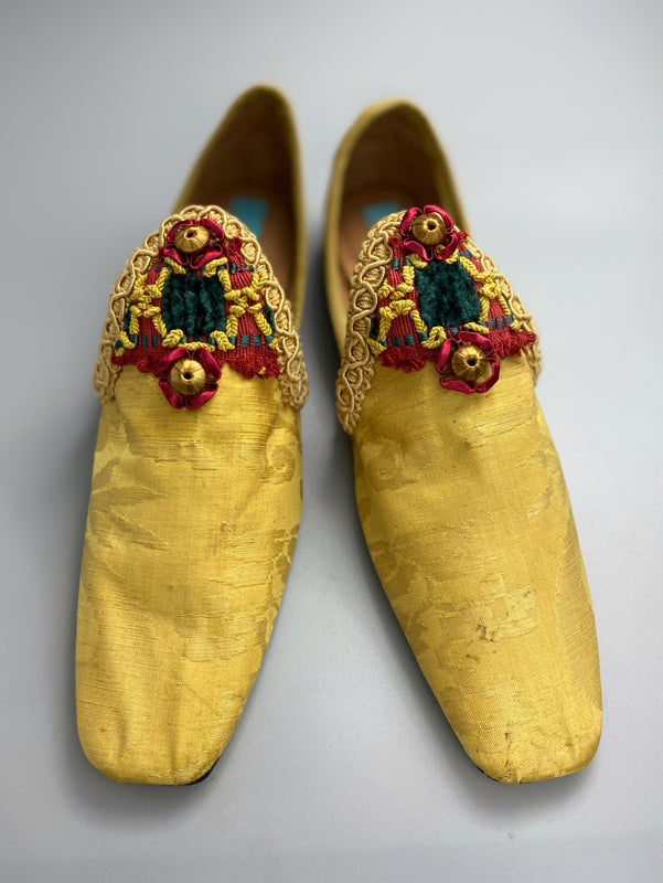 Golden yellow antique silk shoes with red and green silk chenille passementerie braid embellishment. Bohemian styles by Pavilion Parade