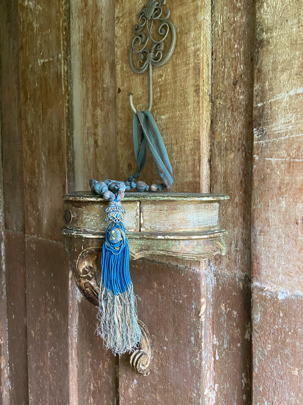 1920s style long silk sautoir necklace with antique tassel embellishment. Bohemian style from vintage textiles by Pavilion Parade. 