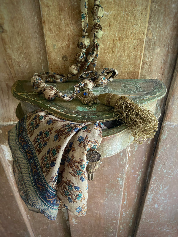 1920s style long silk sautoir necklace with antique tassel embellishment. Bohemian style from vintage textiles by Pavilion Parade. 