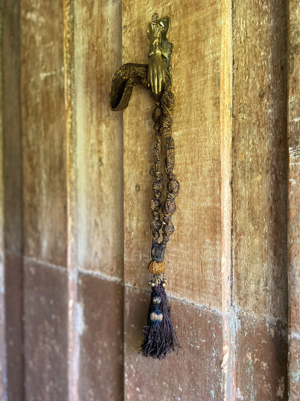 1920s style long silk sautoir necklace with antique tassel embellishment. Bohemian style from vintage textiles by Pavilion Parade. 