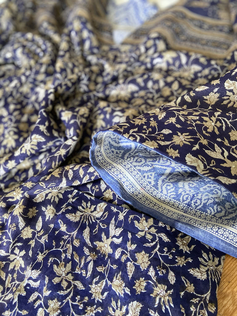 Faded indigo hand block printed fine cotton kaftan dress. Deep V neck, patch pockets, fully reversible. Bohemian style sustainably created from antique and vintage textiles by the Pavilion Parade studioi.
