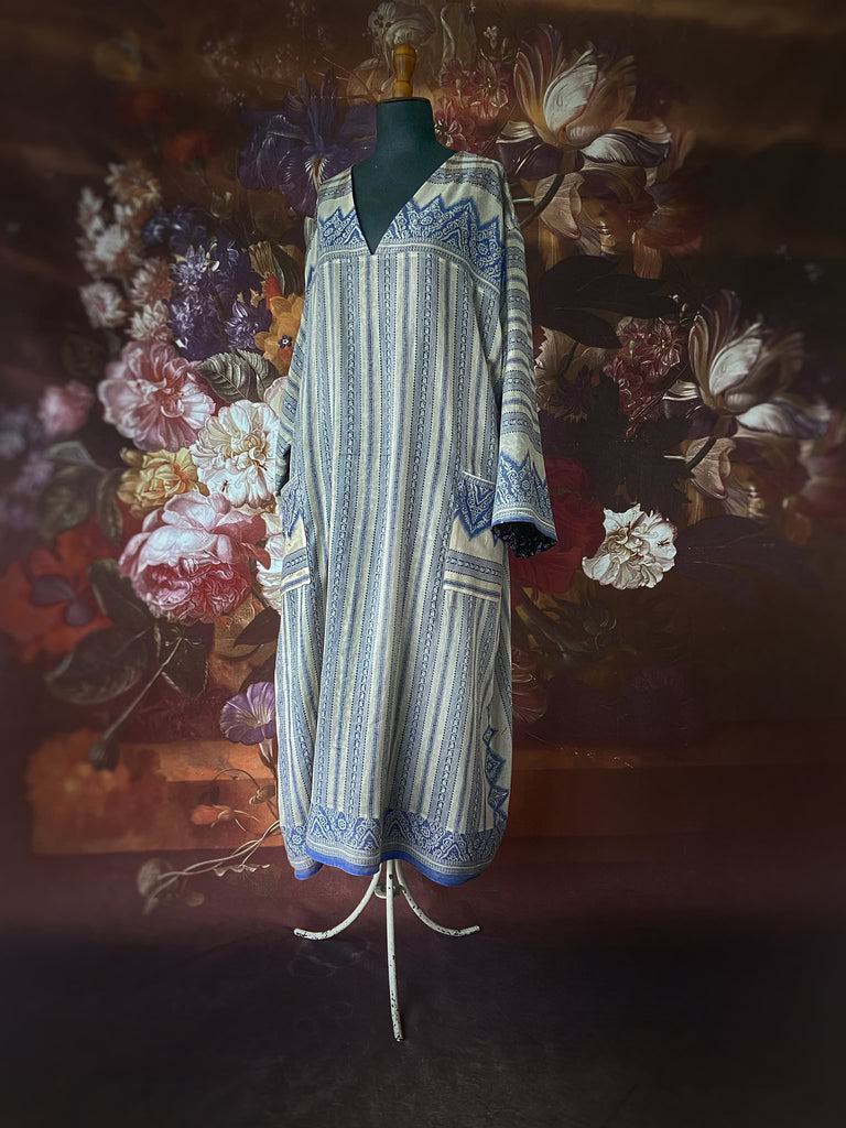 Faded indigo hand block printed fine cotton kaftan dress. Deep V neck, patch pockets, fully reversible. Bohemian style sustainably created from antique and vintage textiles by the Pavilion Parade studioi.