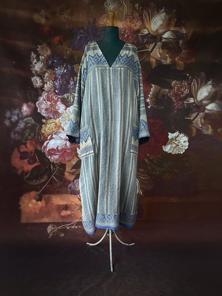 Faded indigo hand block printed fine cotton kaftan dress. Deep V neck, patch pockets, fully reversible. Bohemian style sustainably created from antique and vintage textiles by the Pavilion Parade studioi.