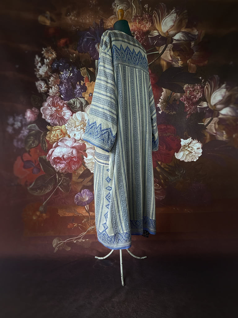 Faded indigo hand block printed fine cotton kaftan dress. Deep V neck, patch pockets, fully reversible. Bohemian style sustainably created from antique and vintage textiles by the Pavilion Parade studioi.