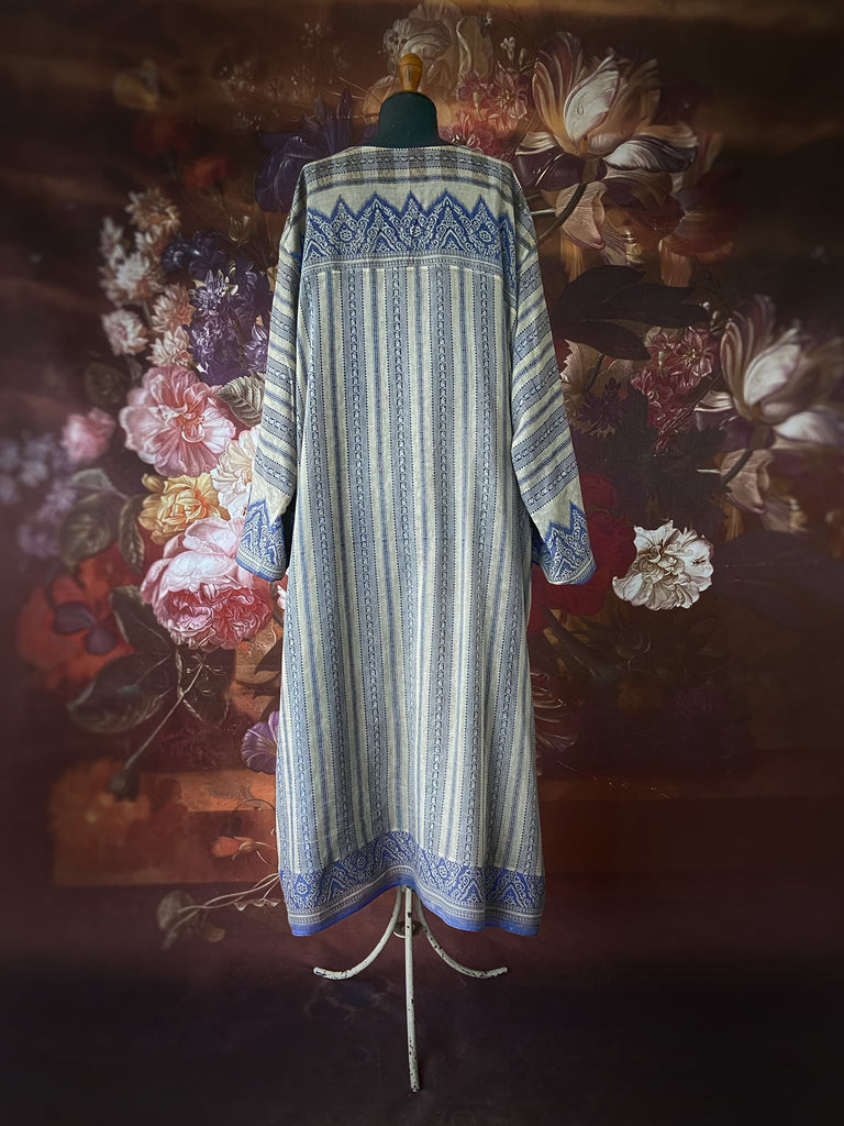 Faded indigo hand block printed fine cotton kaftan dress. Deep V neck, patch pockets, fully reversible. Bohemian style sustainably created from antique and vintage textiles by the Pavilion Parade studioi.