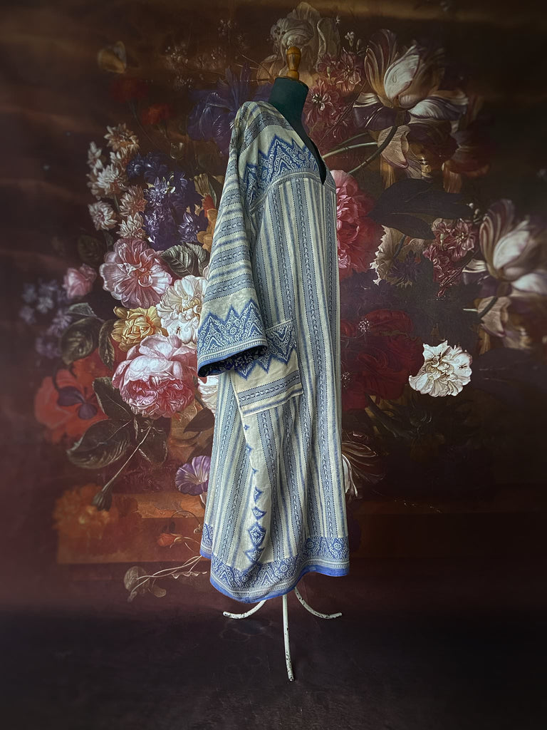 Faded indigo hand block printed fine cotton kaftan dress. Deep V neck, patch pockets, fully reversible. Bohemian style sustainably created from antique and vintage textiles by the Pavilion Parade studioi.
