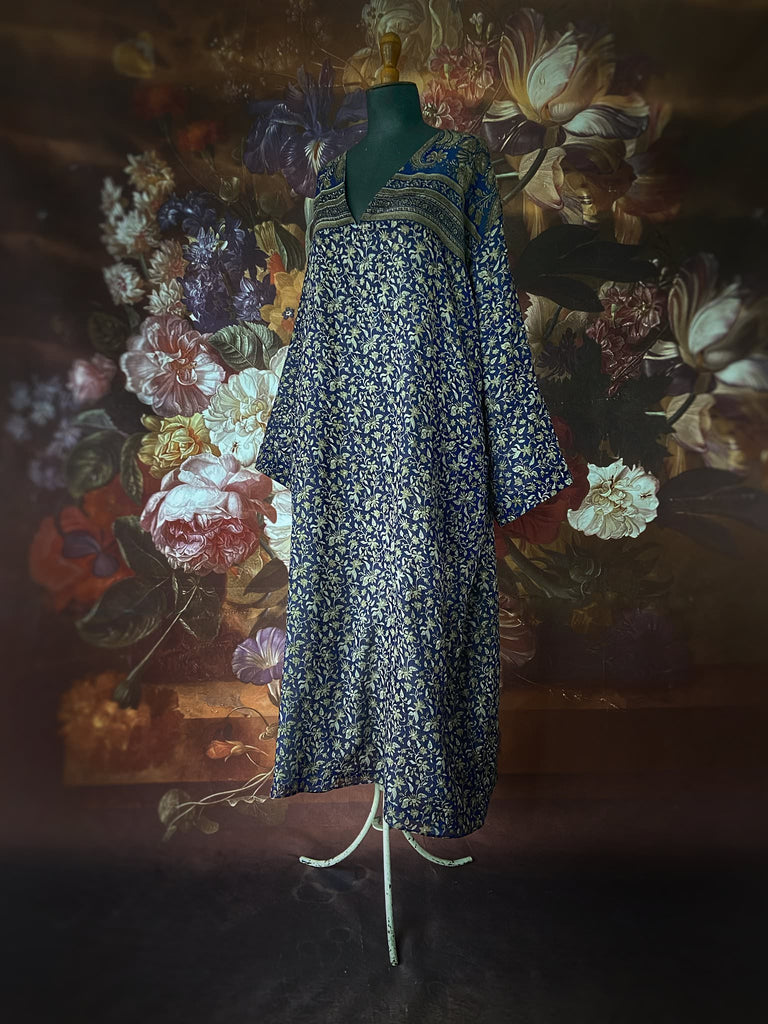 Faded indigo hand block printed fine cotton kaftan dress. Deep V neck, patch pockets, fully reversible. Bohemian style sustainably created from antique and vintage textiles by the Pavilion Parade studioi.