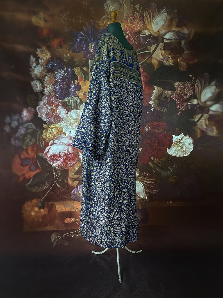 Faded indigo hand block printed fine cotton kaftan dress. Deep V neck, patch pockets, fully reversible. Bohemian style sustainably created from antique and vintage textiles by the Pavilion Parade studioi.