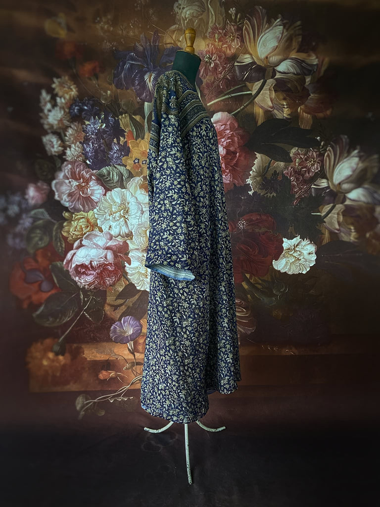 Faded indigo hand block printed fine cotton kaftan dress. Deep V neck, patch pockets, fully reversible. Bohemian style sustainably created from antique and vintage textiles by the Pavilion Parade studioi.