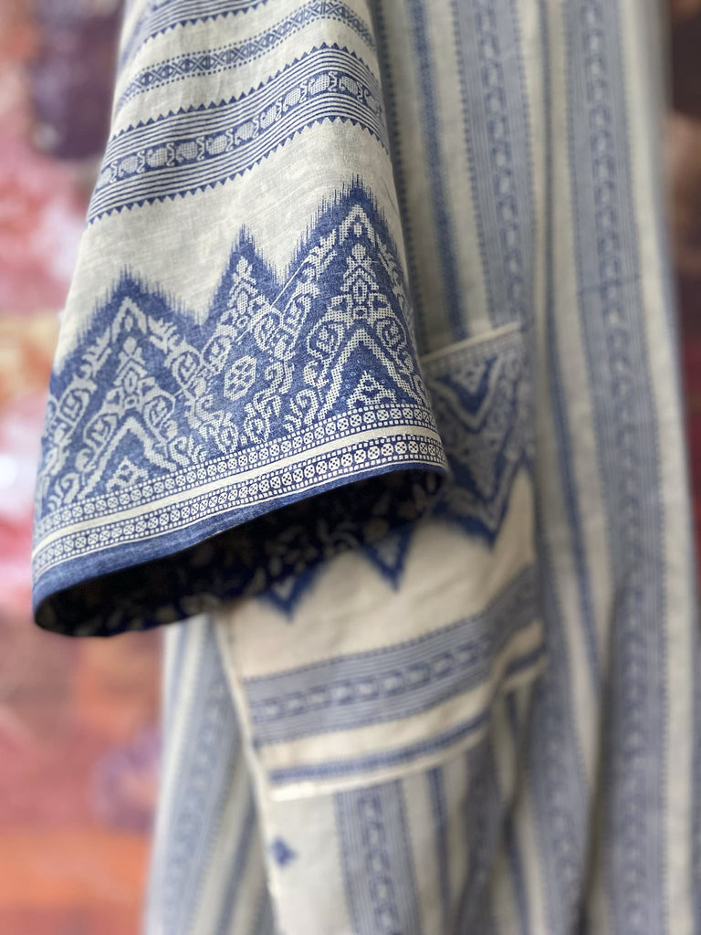 Faded indigo hand block printed fine cotton kaftan dress. Deep V neck, patch pockets, fully reversible. Bohemian style sustainably created from antique and vintage textiles by the Pavilion Parade studioi.
