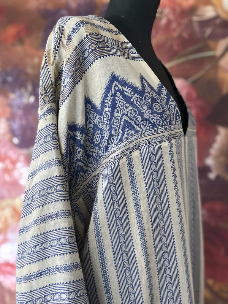 Faded indigo hand block printed fine cotton kaftan dress. Deep V neck, patch pockets, fully reversible. Bohemian style sustainably created from antique and vintage textiles by the Pavilion Parade studioi.
