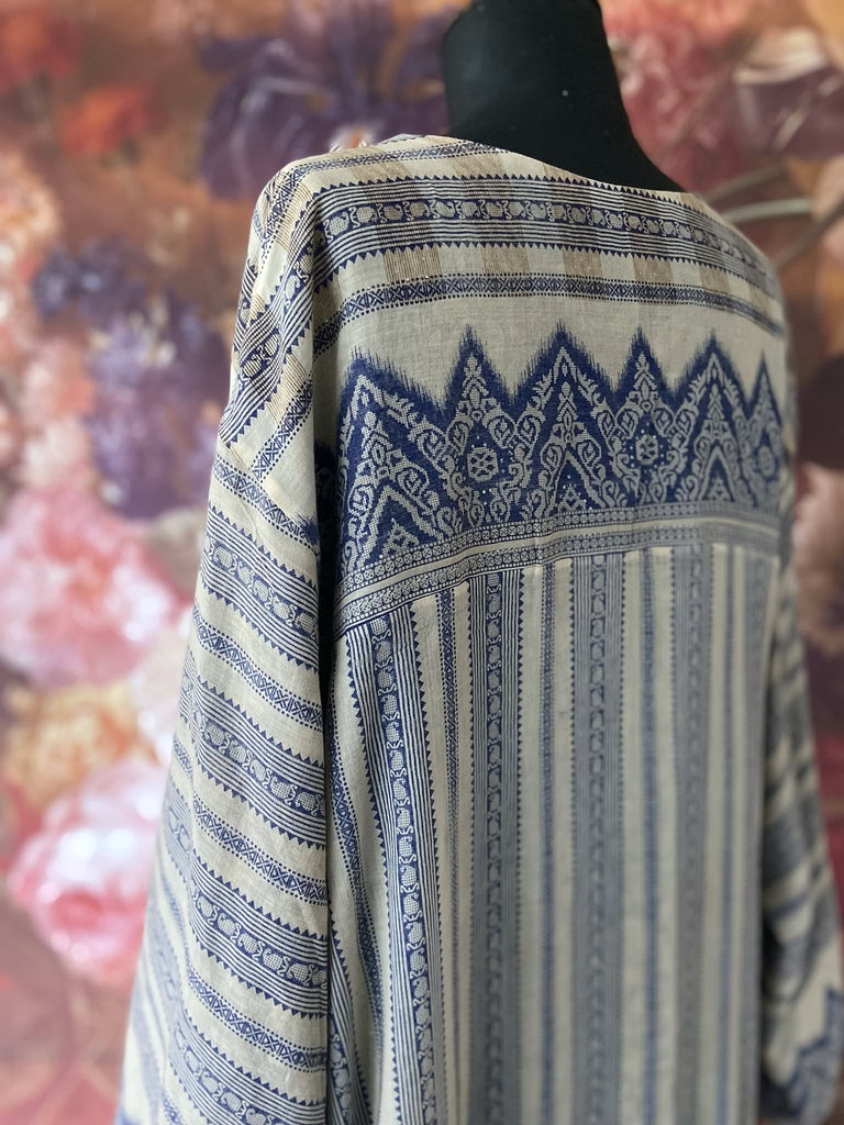 Faded indigo hand block printed fine cotton kaftan dress. Deep V neck, patch pockets, fully reversible. Bohemian style sustainably created from antique and vintage textiles by the Pavilion Parade studioi.