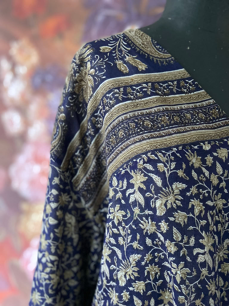 Faded indigo hand block printed fine cotton kaftan dress. Deep V neck, patch pockets, fully reversible. Bohemian style sustainably created from antique and vintage textiles by the Pavilion Parade studioi.