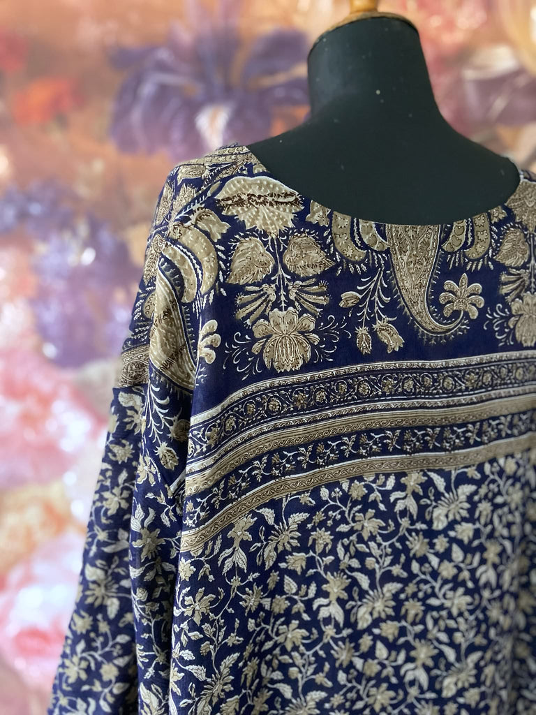 Faded indigo hand block printed fine cotton kaftan dress. Deep V neck, patch pockets, fully reversible. Bohemian style sustainably created from antique and vintage textiles by the Pavilion Parade studioi.