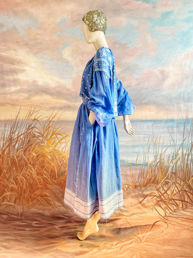 Fine soft pure cotton weave in a fresh sky blue and white palette. Full sleeved faded indigo peasant blouse and full dirndl skirt. Bohemian styles created from vintage textiles by Pavilion parade studio. 