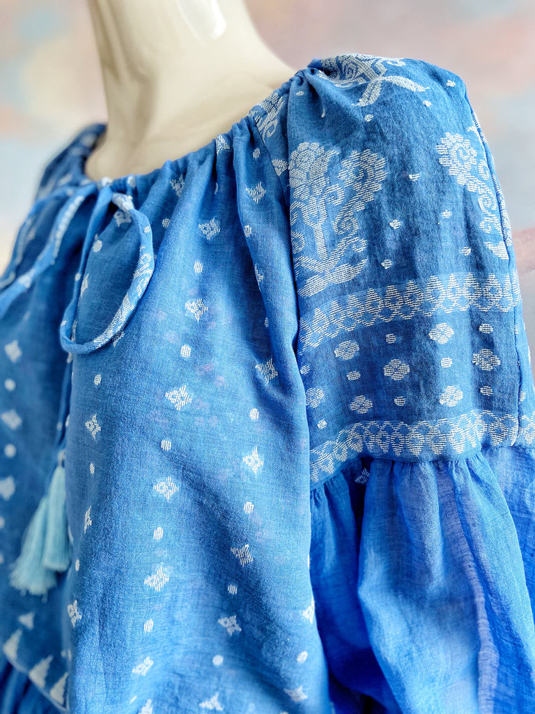 Fine soft pure cotton weave in a fresh sky blue and white palette. Full sleeved faded indigo peasant blouse and full dirndl skirt. Bohemian styles created from vintage textiles by Pavilion parade studio. 