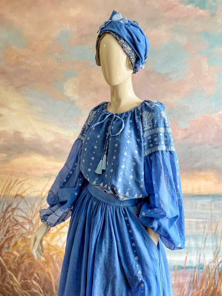 Fine soft pure cotton weave in a fresh sky blue and white palette. Full sleeved faded indigo peasant blouse and full dirndl skirt. Bohemian styles created from vintage textiles by Pavilion parade studio. 