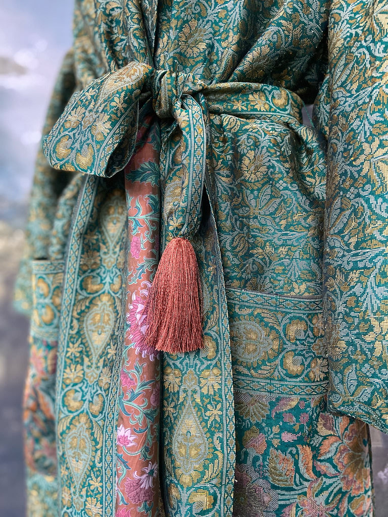 Emerald green, gold and copper silk brocade dressing robe or duster coat with full sleeves, oversize pockets and tassel sash. Bohemian style created from antique and vintage textiles by the Pavilion Parade studio