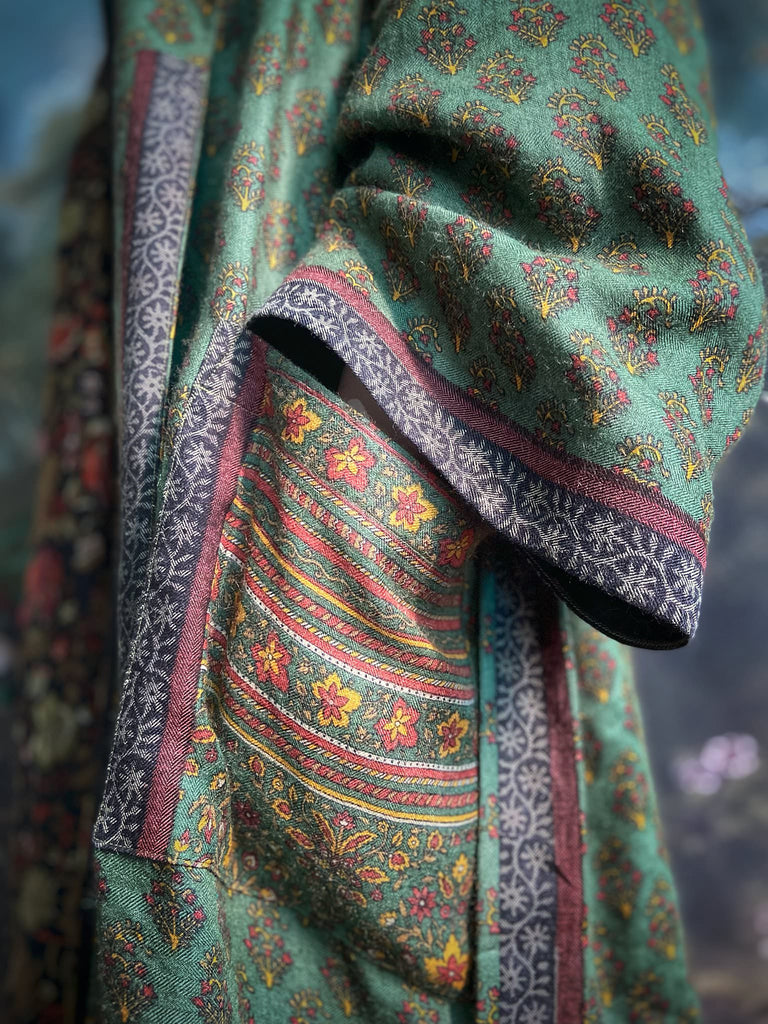 Forest green, conker brown and saffron yellow floral fine wool robe with silk lining. Wide sleeves, deep pockets and tassel sash. Unique bohemian style created from vintage and antique textiles by the Pavilion Parade studio.