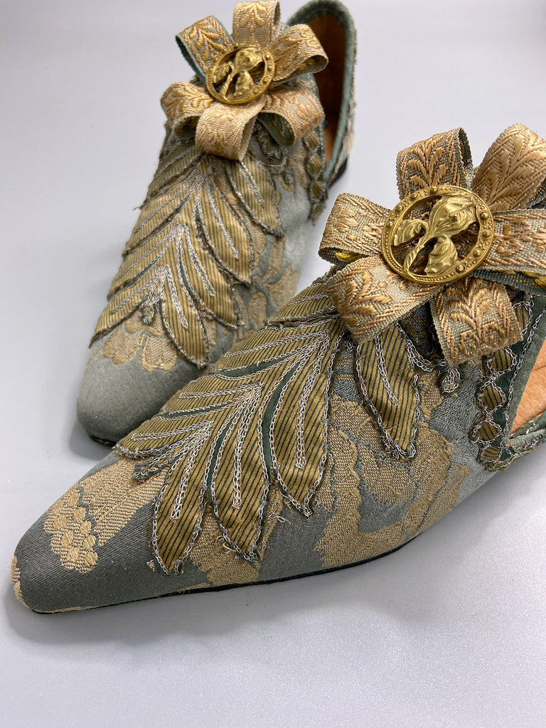 French grey and gold silk brocade shoes with Belle Epoque iris rosettes. Bohemian style created from antique textiles by the Pavilion Parade studio.
