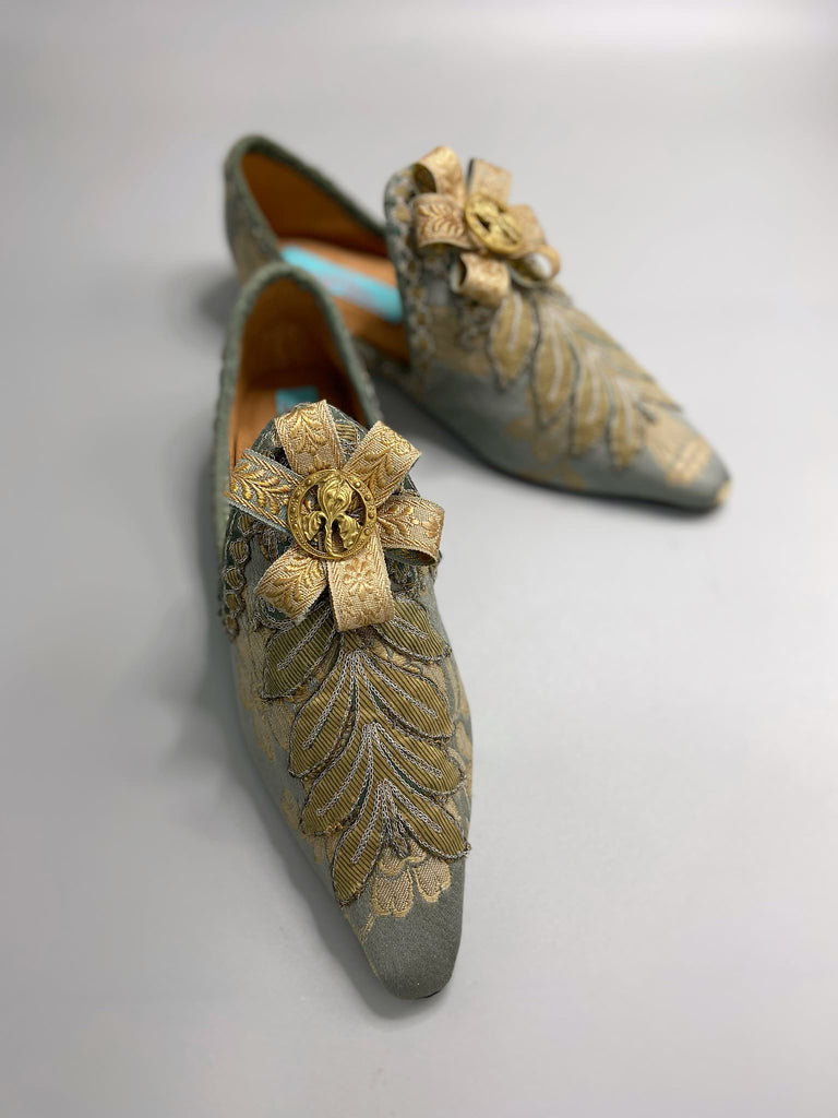 French grey and gold silk brocade shoes with Belle Epoque iris rosettes. Bohemian style created from antique textiles by the Pavilion Parade studio.