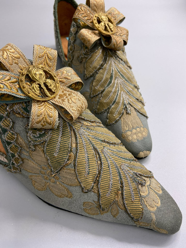 French grey and gold silk brocade shoes with Belle Epoque iris rosettes. Bohemian style created from antique textiles by the Pavilion Parade studio.