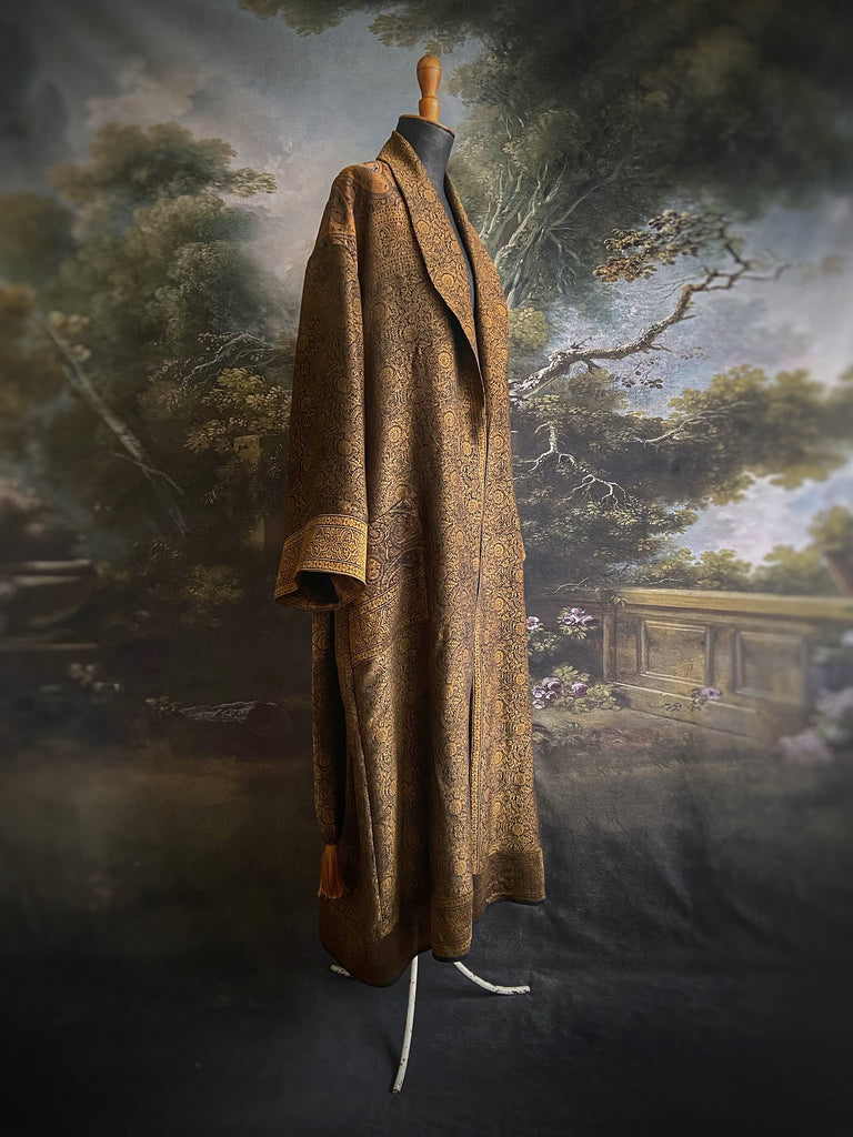 Gold and black silk brocade luxury dressing robe with printed silk lining and tassel sash. Bohemian style created from antique and vintage textiles by the Pavilion Parade studio.